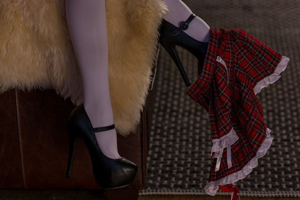 A doll with plump chest and hips, and a realistic doll with a slim face